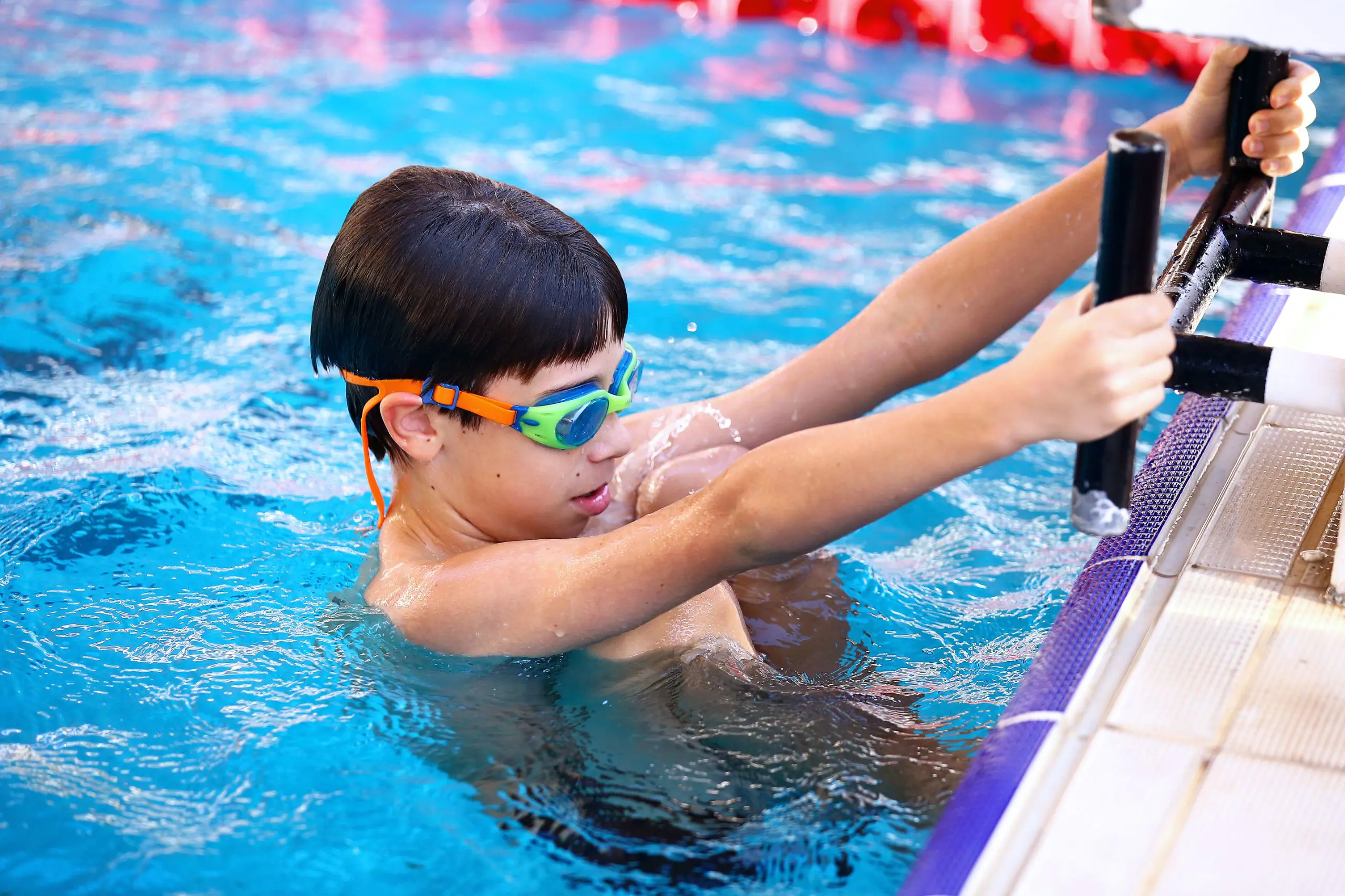 Child swimming in school pool